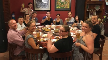 A group of tour goers from Betel Box Asia enjoying local food at a restaurant