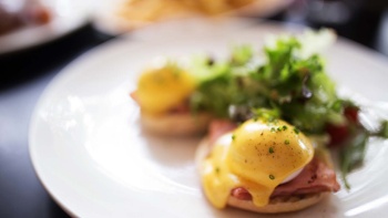 A plate of Eggs Benedict from a restaurant in Dempsey Hill