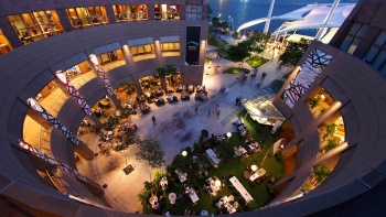 An aerial view of the exterior of Esplanade with people dining on the ground floor.