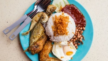 A top down view of a plate of Nasi Lemak