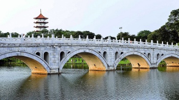 The 13-arch bridge on tranquil waters. 