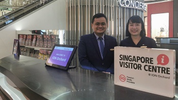 Two customer service officers at the ION Orchard concierge