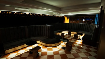 Không gian ẩm thực trong phòng lounge với ánh đèn mờ ảo của NOX