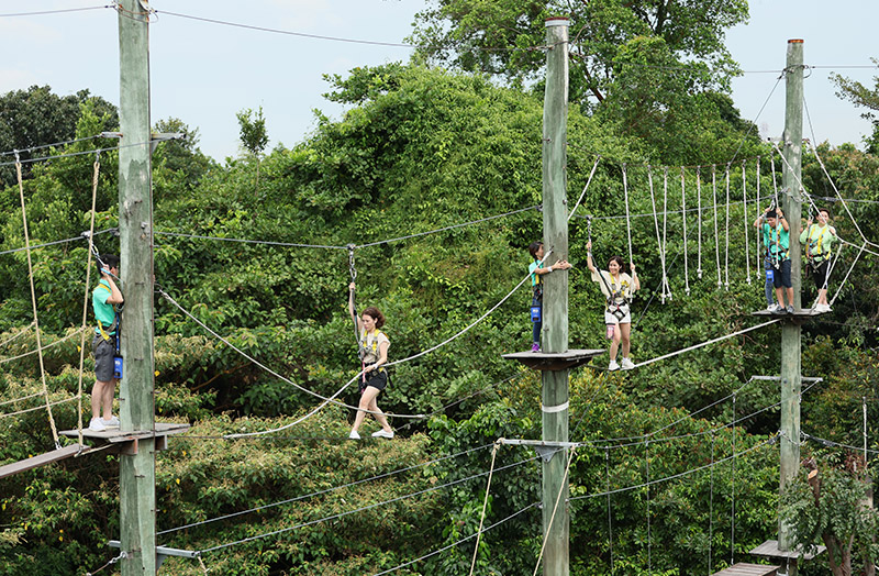 Herbalife Nutrition distributors participate in a team-building activity at Mega Adventure Singapore.