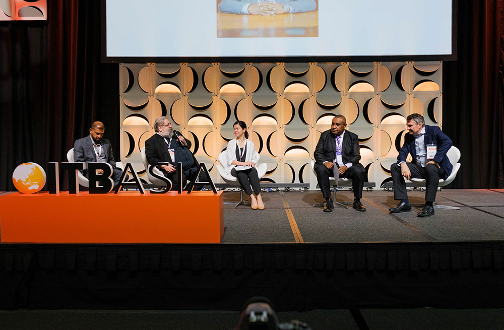 ITB Asia 2022: Four men and one woman on panel, speaker leads while others actively listen.