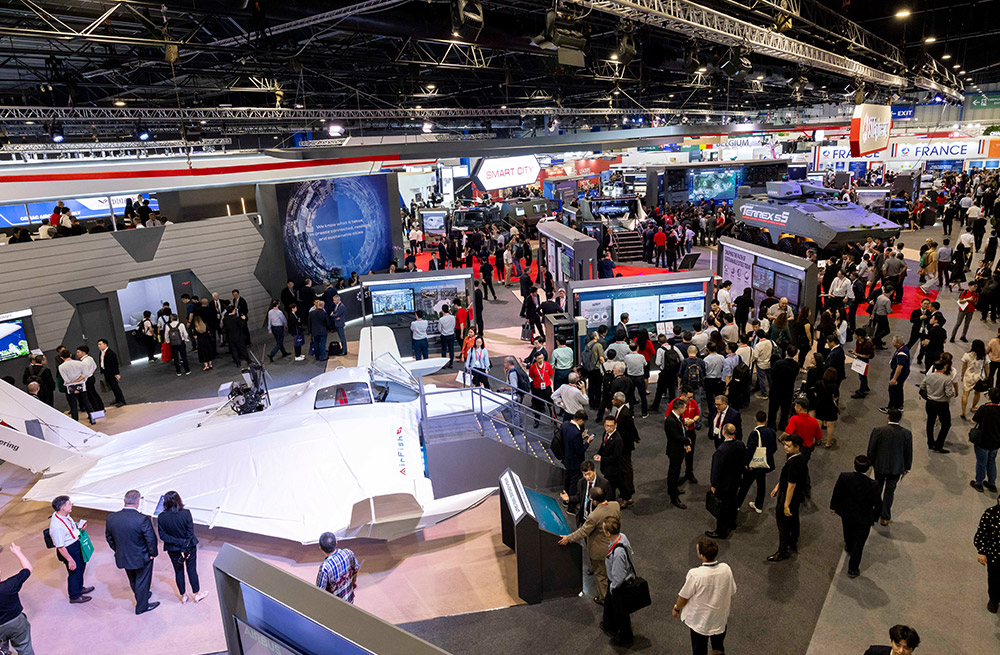 Visitors exploring exhibition booths featuring new technology demos at Singapore Airshow 2024