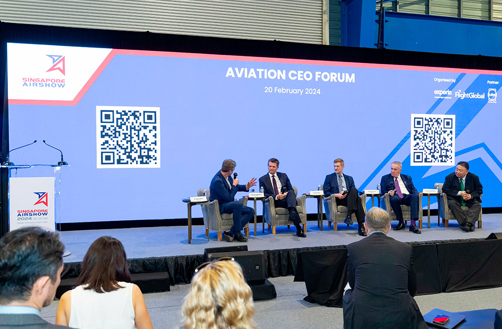 Attendees observe leaders discussion on aviation challenges at Singapore Airshow 2024