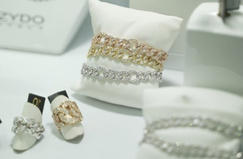 Close-up display of luxury diamond bracelets and rings from the ZYDO collection at Singapore International Jewelry Expo 2023