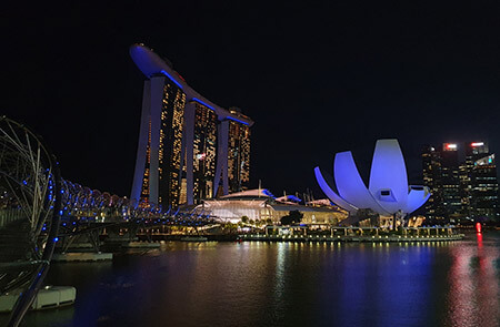 Singapore's Marina Bay Sands and ArtScience Museum illuminated in blue light at night to commemorate World Stroke Day