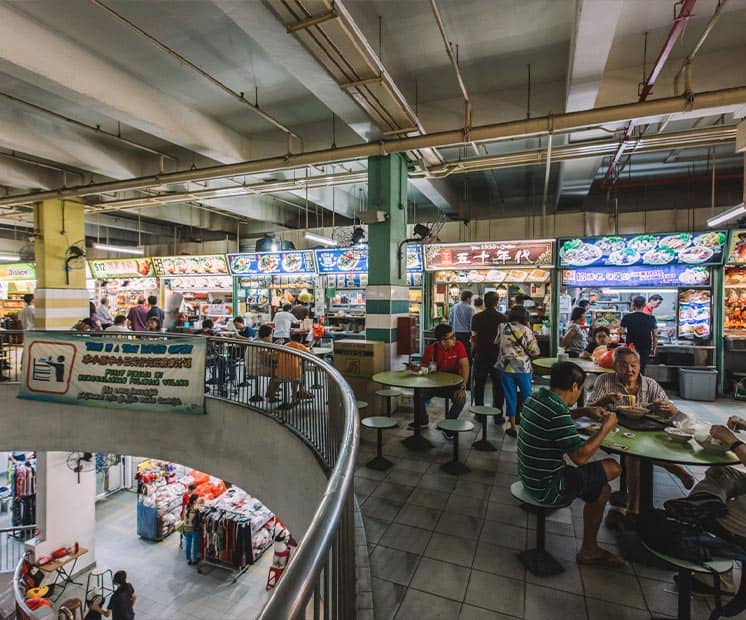 Family enjoying food together in Chinatown hawker street