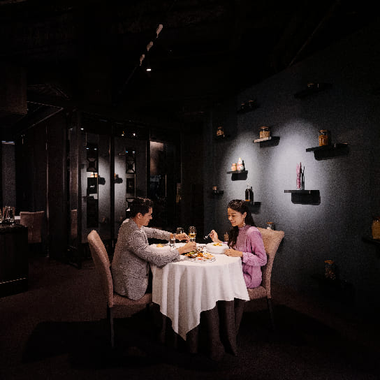Couple having dining experience at Labyrinth restaurant