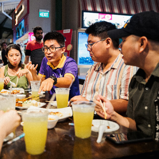  People enjoying Singapore street food
