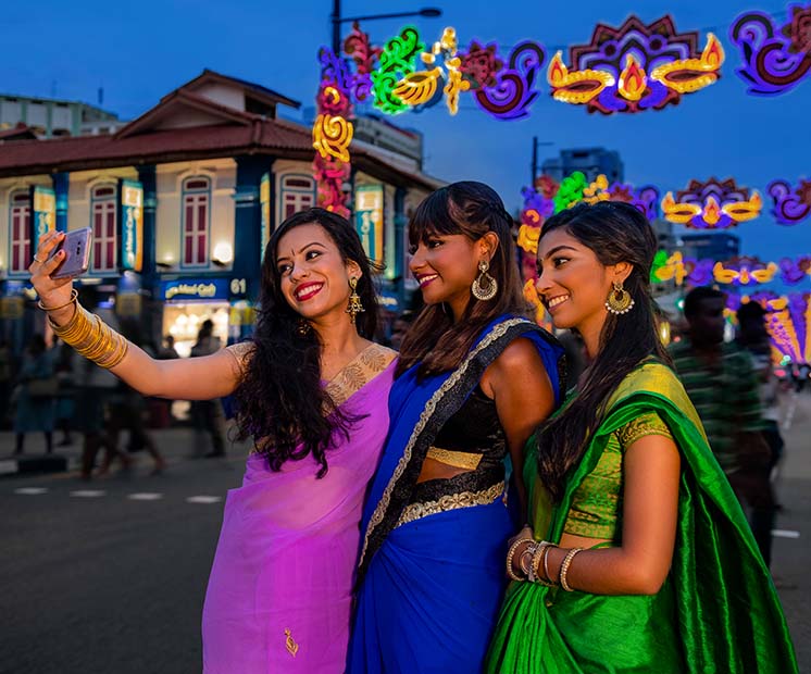 Group of ladies dressed up in tradional festive dresses