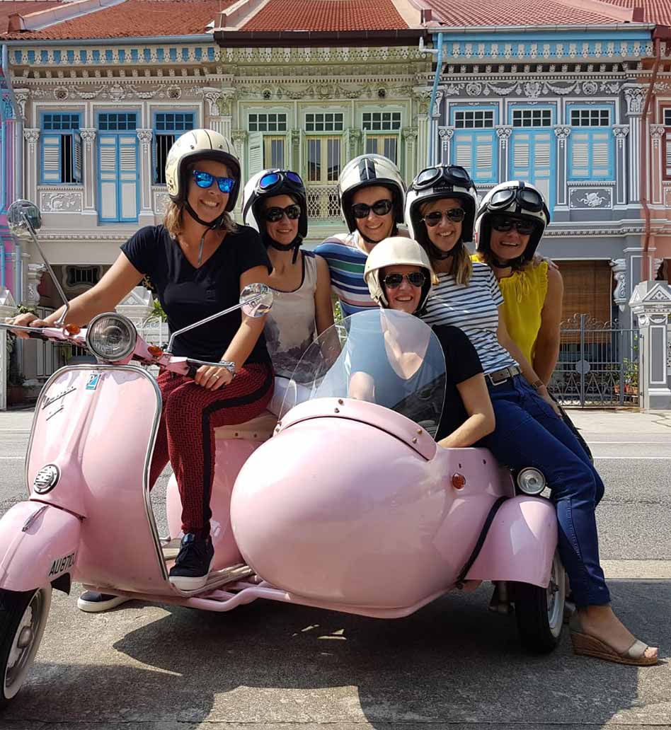 Girls Gang on vintage Vespa scooter with sidecar