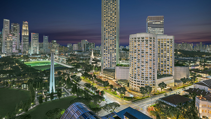Fairmont Singapore luxury hotel at night, GSTC-certified