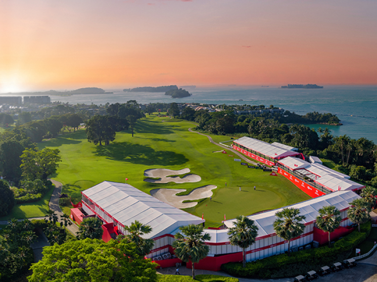 Aerial view of Singapore's Sentosa Golf Club with lush green fairways and sandy bunkers.
