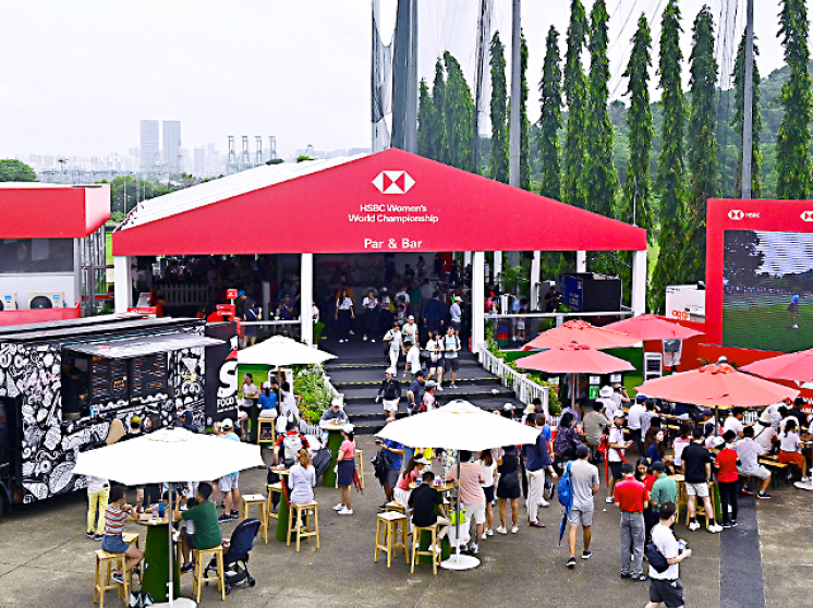 Crowd enjoying drinks and at the Par & Bar in the Fan Village of the HSBC Women's World Championship.