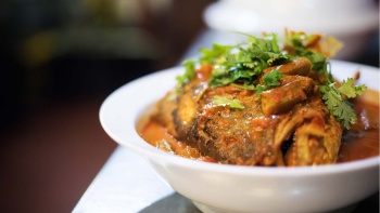 A bowl of fish head curry from Banana Leaf Apolo