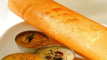 A plate of thosai with side dishes
