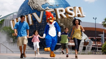 Woody Woodpecker mascot posing with a family at Universal Studios Singapore