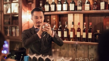 Mr Daiki Kanetaka, head bartender of D.Bespoke, crafting a cocktail at his bar.