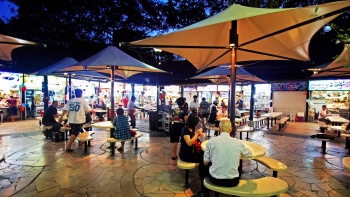 Night shot of people dining under the canopies