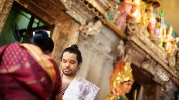 Over shoulder image of a visitor in Sri Krishnan temple