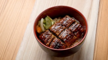 Delicious bowl of Unagi (Freshwater eel) with Japanese rice and pickles from Man Man