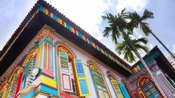 A close up view of the upper section of Tan Teng Niah House at Little India with colourful windows