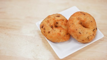 Two pieces of vadai on a plate