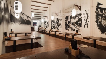 An empty and spacious interior shot of Harāru Izakaya
