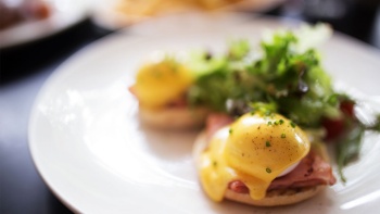 A plate of Eggs Benedict.