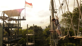 A young child braving an obstacle course at Mega Adventure Park