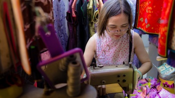A seamstress at Golden Scissors Cheongsam located in People’s Park Centre at Chinatown