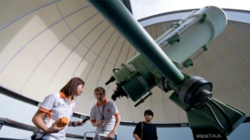 Staff at the Science Centre Singapore giving a demonstration at The Observatory