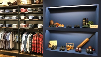 Blue shelf displaying leather shoes and shirts at The Shirt Bar
