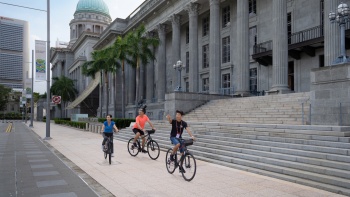 A group of people cycling at the Civic District.