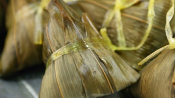 Rice dumplings covered in bamboo leaves