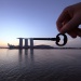 Silhouette of a key placed against Marina Bay Sands.  