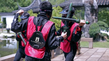 Men carrying laser tag swords at Ninja Tag Singapore