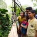 A close up shot of a family and a ring-tailed lemur in the Singapore Zoo’s Fragile Forest