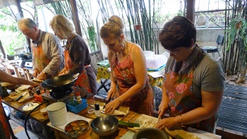 People participating in a cooking class at Cookery Magic