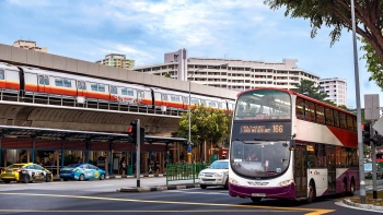 Image of moving bus and MRT train.