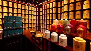 Rows of TWG tea containers on display.