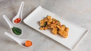 A plate of salted egg <i>sotong</i> and its condiments from Segar Village