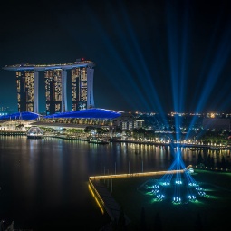 Light projection display against the iconic Marina Bay skyline in Singapore