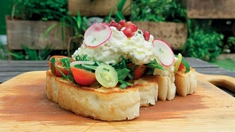 Feta Burrata, a turkish bread with basil leaves, cheese and tomato salad from Artichoke