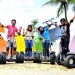 Tour participants on Segway scooters at Siloso Beach, Sentosa