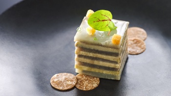 Close up of mille-feuille of <i>foie gras</i> and artichoke with white truffle served at Les Amis