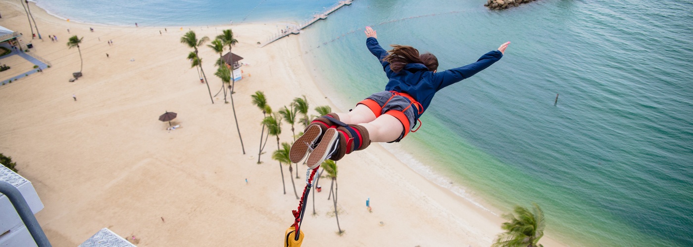 Lady experiencing the bungy jump at AJ Hackett Sentosa